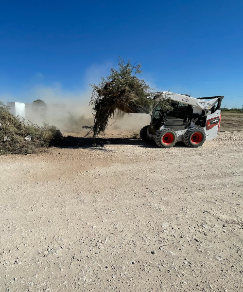 A tractor that is sitting in the dirt